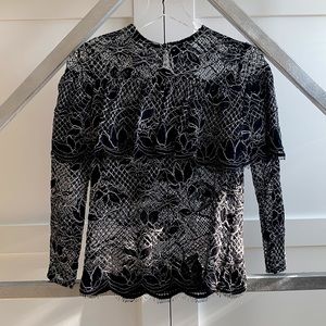 Black and white lace blouse with faux off-the-shoulder effect